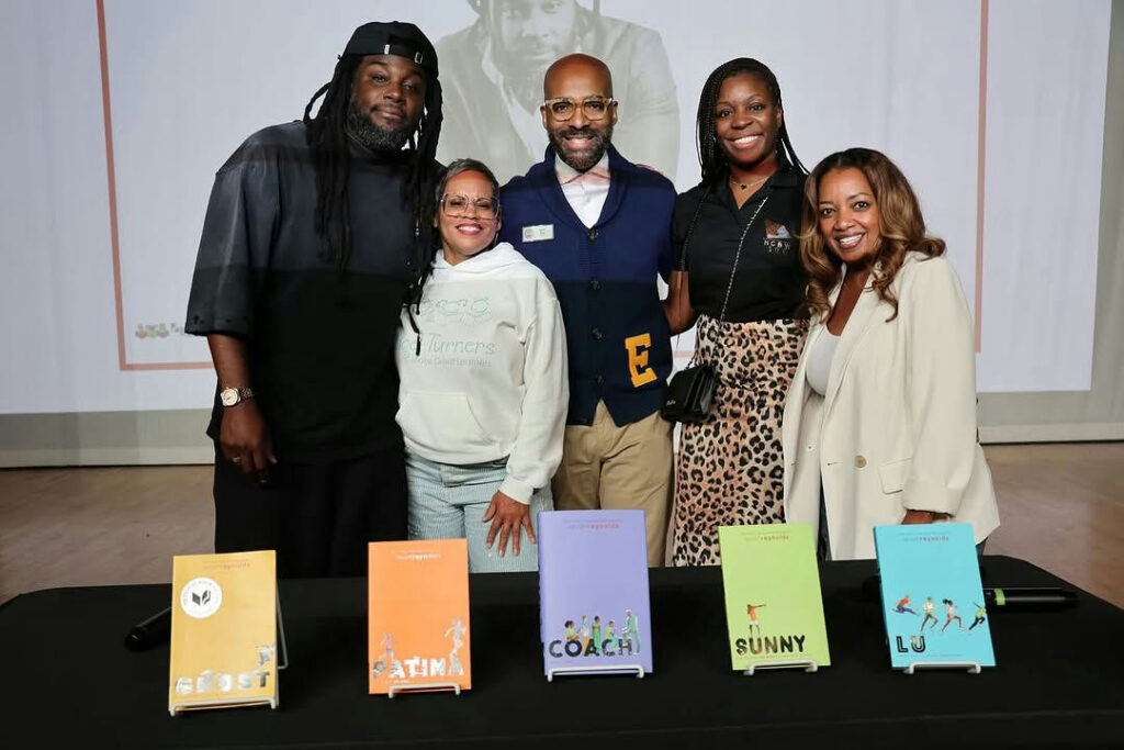 Photo by Atlanta Public Schools on October 28, 2025. May be an image of ‎one or more people, people standing, book, magazine and ‎text that says '‎JS Hurners Turnens E SROST PATINA COACH وشه COACH SUNNY LU‎'‎‎.