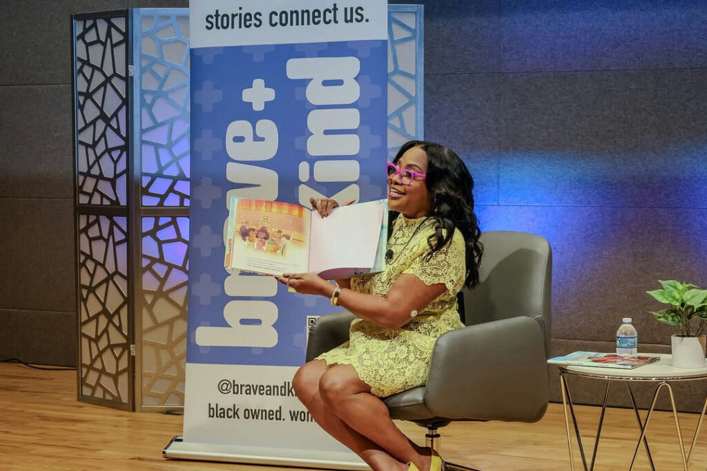 Photo shared by Fulton County Library System on October 20, 2025 tagging @sherrieshepherd, @fultoninfo, @braveandkindbooks, @afplf_atl, and @fulcolibrarycentral. May be an image of one or more people, magazine, book and text.