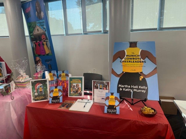 Photo by Fulton County Library System on October 01, 2025. May be an image of banner, poster, book, office and text that says 'MUNICH COWBOYS CHEERLEADERS ham MBePy ΚWΔΝEЛR Knd Martha Hall MarthaHallKelly Kelly & Kathy KathyMurray Murray 3aoHи'.
