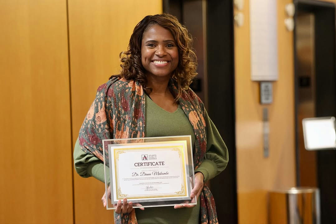 Photo shared by Atlanta Public Schools on November 06, 2025 tagging @apsboe. May be an image of one or more people, people smiling and text.