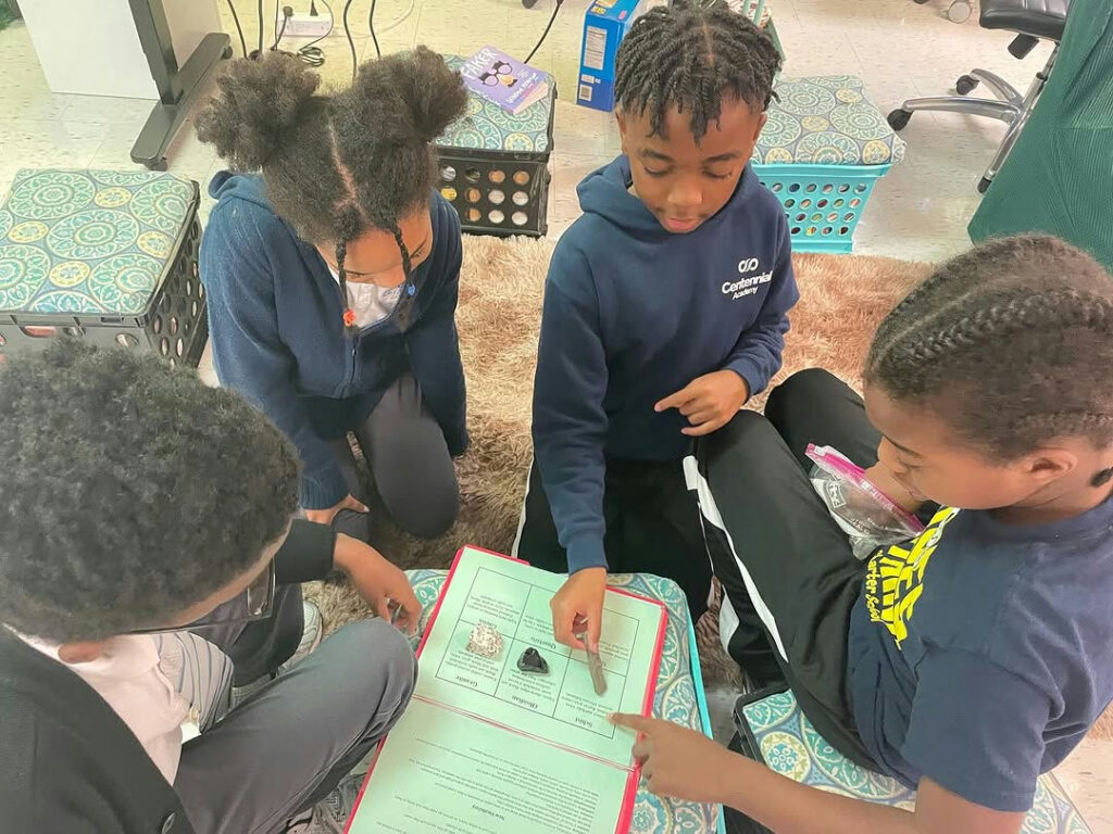 Photo by Centennial Academy on November 05, 2025. May be an image of studying, childrens toy, lego and text.