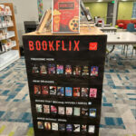Photo by Fulton County Library System on January 19, 2026. May be an image of rack, poster, screen, book, shelf and text.