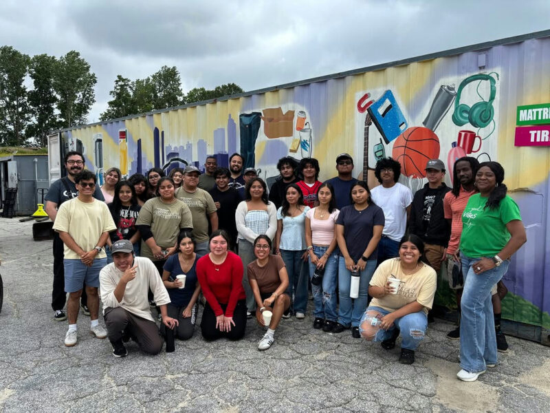 Photo by Live Thrive on July 07, 2025. Puede ser una imagen de 9 personas, personas de pie y texto.