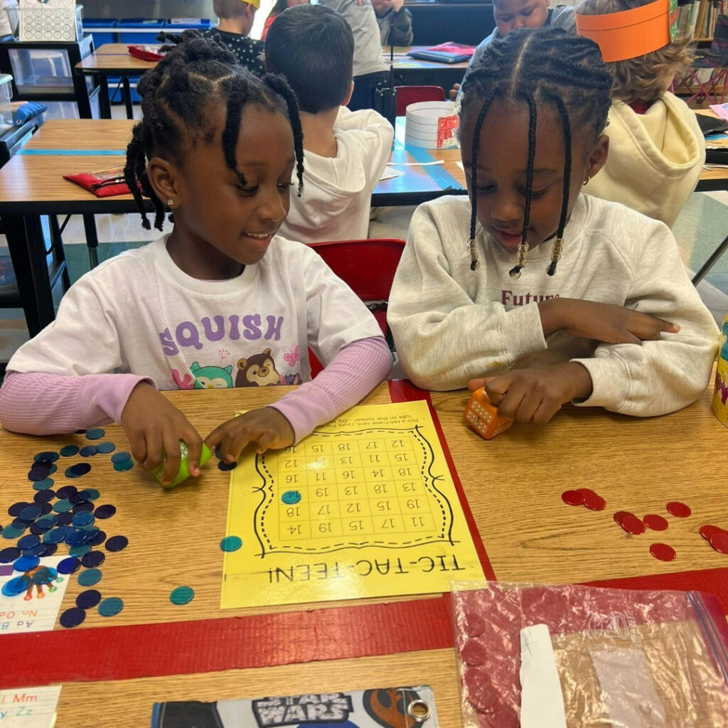 Photo by Fulton County Schools on January 09, 2025. Puede ser una imagen de 3 personas, juguete para niños, Lego y texto.